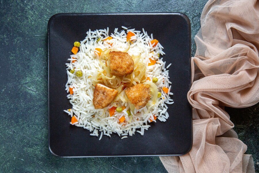 A beautifully plated dish of fluffy, perfectly cooked rice, capturing the ideal texture.