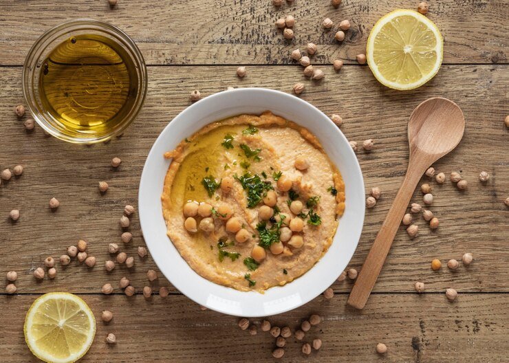 A vibrant bowl showing the rich gravy tender chicken and creamy chickpeas